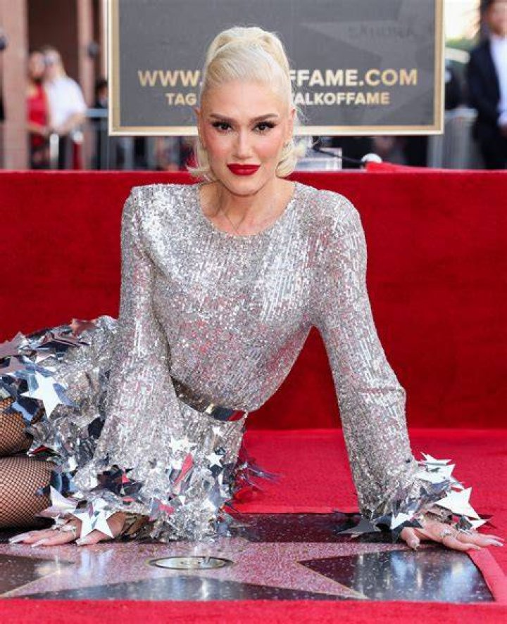 Gwen Stefani matches her silver dress to her new star at Hollywood Walk
